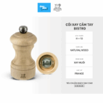 Hand-held blue pepper mill